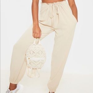 Cream, drawstring waist. Cuffed pants